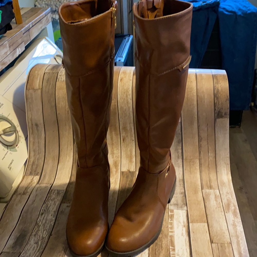 Never worn knee high boot